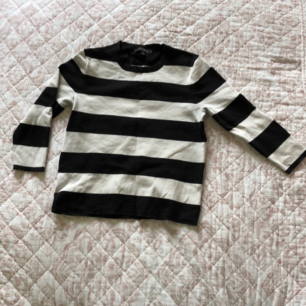 Black and white crew neck sweater.